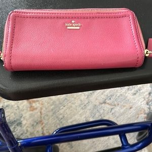 Kate Spade unique pink with light, pink interior, pockets, galore inside &o out
